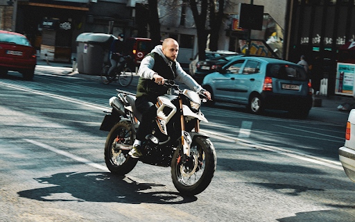 A Man Riding a Motorcycle on the Road from Chrome web store to be run with OffiDocs Chromium online A Man Riding a Motorcycle on the Road from Chrome web store to be run with OffiDocs Chromium online