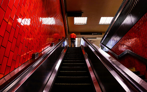 A Person Standing on the red Escalator from Chrome web store to be run with OffiDocs Chromium online A Person Standing on the red Escalator from Chrome web store to be run with OffiDocs Chromium online