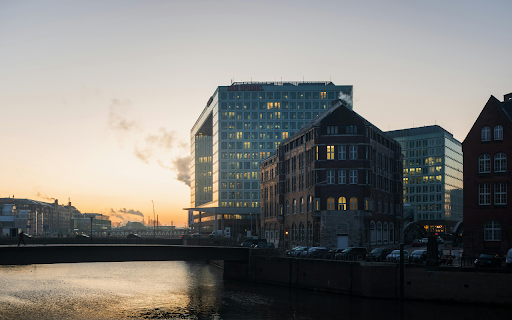 A river with buildings in the background at sunset from Chrome web store to be run with OffiDocs Chromium online A river with buildings in the background at sunset from Chrome web store to be run with OffiDocs Chromium online